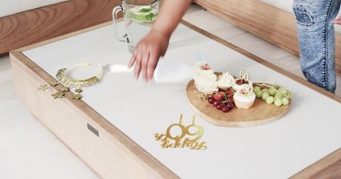 Clearing after celebration with food and decorations on table