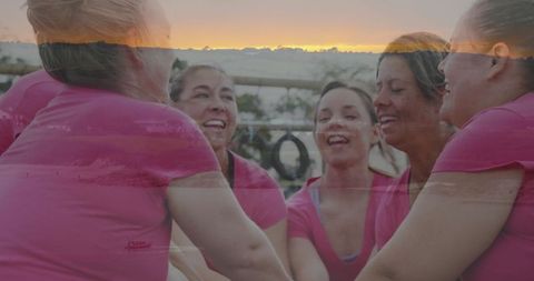 Women in Pink Celebrating Victory on Obstacle Course