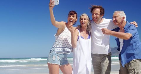 Joyful Multigenerational Friends Taking Selfie on Sunny Beach - Download Free Stock Images Pikwizard.com