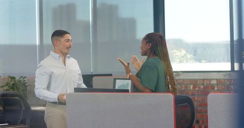 Positive Office Discussion with Team High Five for Project Success