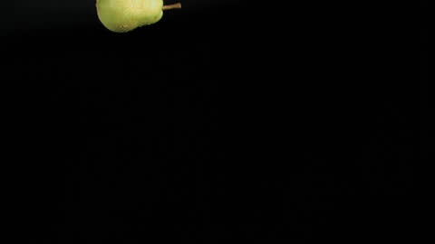 Floating Peach in Slow Motion on Black Background