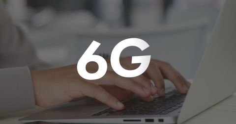 Hands Typing on Laptop with 6G Wireless Network Concept