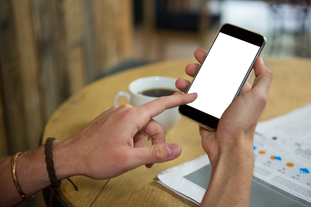 Hands with Mobile Phone at Cafe Revealing Clear Screen in Relaxed Setting - Download Free Stock Videos Pikwizard.com