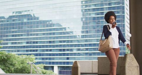 African American Businesswoman Talking on Smartphone in Urban Environment