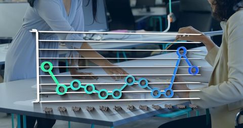 Business Meeting with Overlayed Analytics Chart