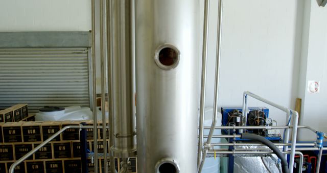 Modern Distillery Equipment with Tubular Steel Tanks and Boxes of Rum and Gin - Download Free Stock Images Pikwizard.com