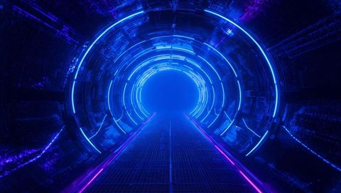 Futuristic neon tunnel with glowing rings and grated walkway