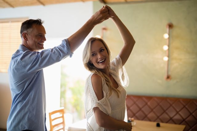 Romantic couple dancing together in restaurant