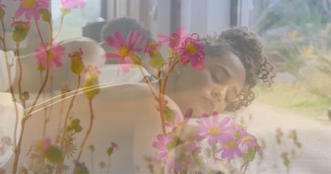 Woman Relaxing on Massage Table Amid Wildflowers