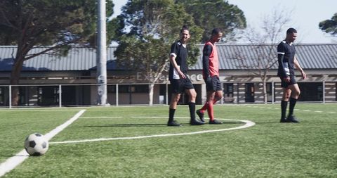 Teen Soccer Players Planning on Field During Practice