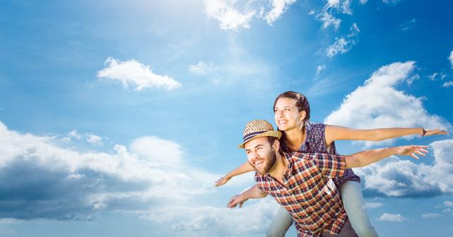 Happy Couple Imagining Flying Against Blue Sky with Clouds - Download Free Stock Photos Pikwizard.com