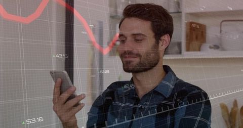 Bearded man checking mobile trading app at home with financial chart overlay