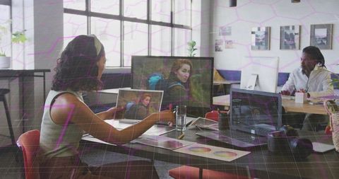 Creative professional analyzing photography in modern design studio