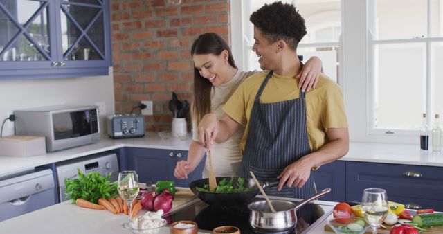 Perfect for illustrating happy relationships, family activities, healthy lifestyle, home cooking, and interracial couple representation. Suitable for use in lifestyle blogs, cooking websites, recipe books, and health-related articles.