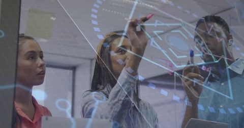 Engineers Collaborating on Design Using Glass Board