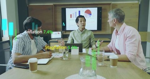 Business Professionals Analyzing Economic Data in Modern Meeting