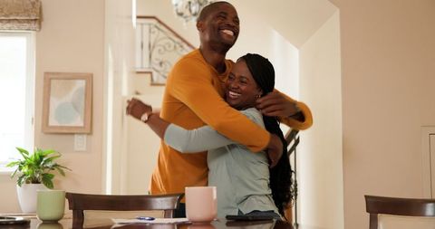 Joyful African American Couple Enjoying Morning Discussion at Home