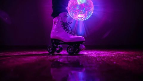 Rolling white quad skate under disco ball glowing neon, reflecting on glossy dancefloor