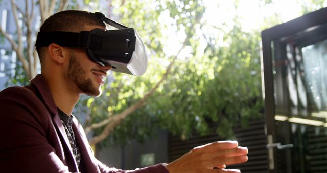 Man Experiencing Virtual Reality in Outdoor Setting on Sunny Day - Download Free Stock Images Pikwizard.com