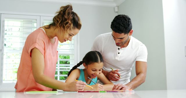 Parents Helping Daughter with Homework in Bright Kitchen - Download Free Stock Images Pikwizard.com