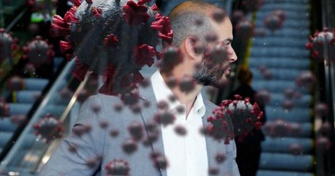 Businessman in Scape of Digital Virus Illustrations on Escalator