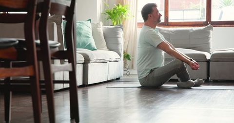 Senior Man Practicing Mindfulness and Quiet Relaxation in Cozy Home