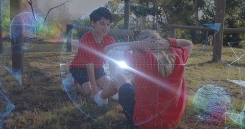 Children Doing Sit-Ups in Park with Holographic Overlays Representing Fitness Technology