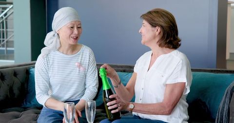 Senior Women Celebrating Together Casual Living Room Setting