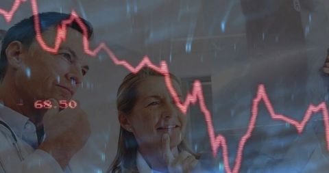 Medical Team Reviewing Radiology with Data Graph Overlay