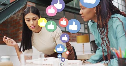 Collaborative architects reviewing scale model in modern loft office