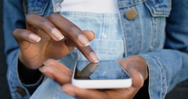 Close-up of Person Using Smartphone in Denim Jacket - Download Free Stock Images Pikwizard.com