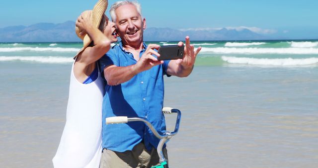 Happy Senior Couple Taking Selfie on Bicycle at Beach - Download Free Stock Images Pikwizard.com