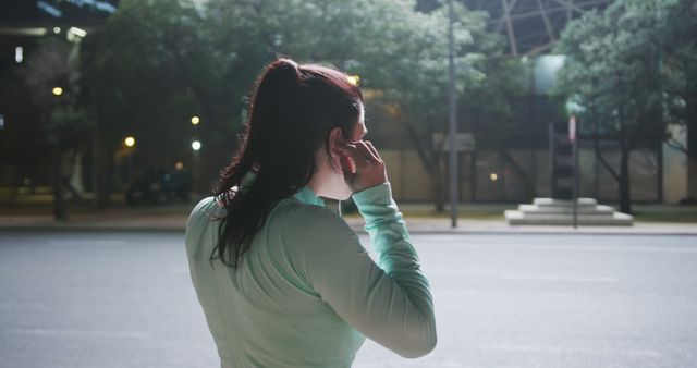 Woman Preparing for Night Run in Urban Street - Download Free Stock Images Pikwizard.com