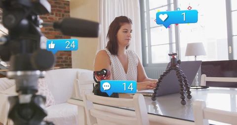 Female content creator engaging with digital audience at home