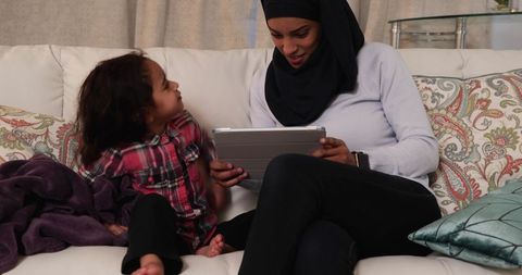 Mother and Daughter Sharing Quality Time with Tablet at Home