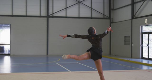 Graceful Gymnast Performing Routine in Indoor Gymnasium - Download Free Stock Images Pikwizard.com