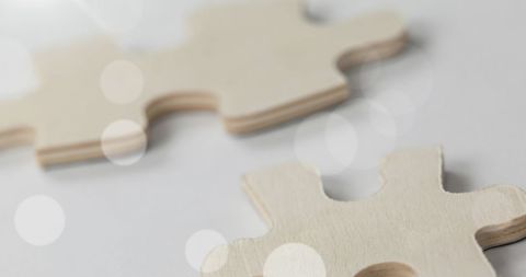 Close-Up of Beige Puzzle Pieces with Bokeh Effect - Download Free Stock Images Pikwizard.com