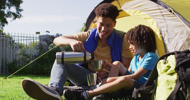 Father and Son Enjoying Outdoor Camping in Sunny Garden - Download Free Stock Images Pikwizard.com