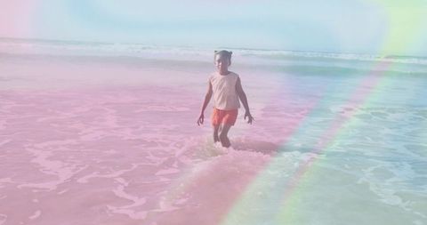 Joyful Child Enjoying Beach Waves with Vibrant Summer Colors
