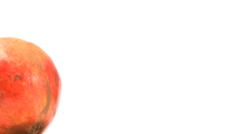 Pomegranate in Focus Against Clean White Background