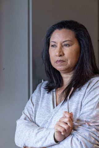 Professional woman contemplating in minimalist office setting