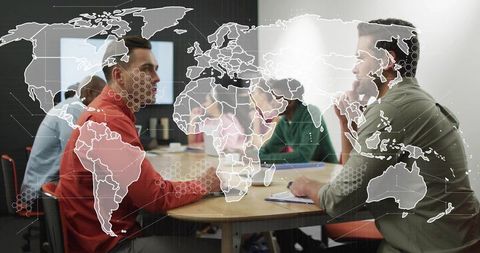 Global team strategy meeting around round table with digital world map overlay