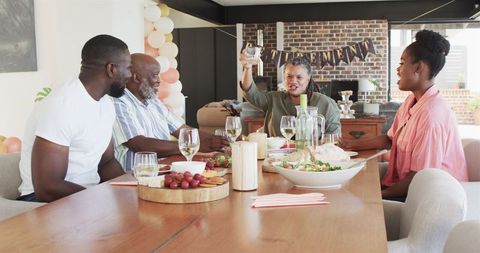 Multigenerational Family Celebrating Retirement with Toast