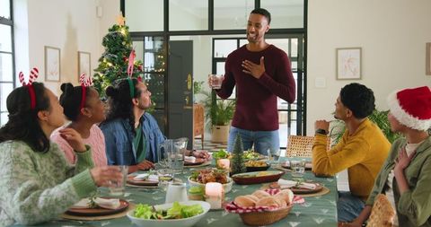 Friends Celebrating Festive Meal at Home During Holiday Season