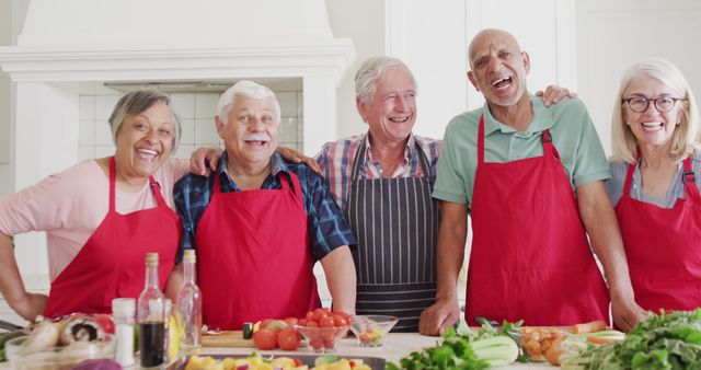 Senior Group Cooking Together in Kitchen and Smiling - Download Free Stock Images Pikwizard.com