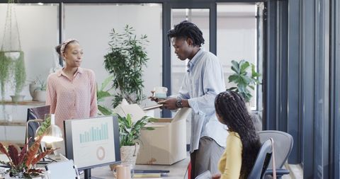 Diverse team explores data insights together in modern office