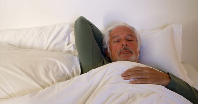 Elderly man sleeping peacefully in bed - Download Free Stock Images Pikwizard.com