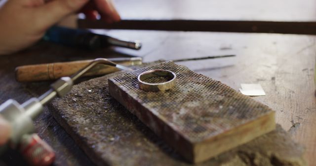 Jeweler Crafting Silver Ring on Workbench - Download Free Stock Images Pikwizard.com