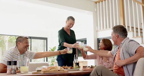 Diverse Family Sharing Holiday Meal Around Large Table
