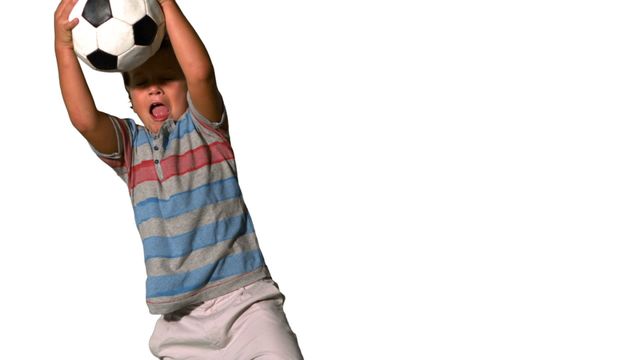 A young boy energetically catching a soccer ball against a plain white background. This dynamic and playful depiction can be used for advertising children's sports activities, illustrating youthful energy and motion, and promoting exercise and physical play. Ideal for use in educational materials, sports campaigns, and playful project themes.